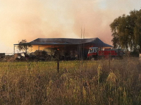 Hay fire continues to smoulder in Peak Hill