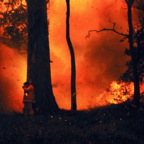 Fire rages into the night during the Black Christmas fires, 2001.