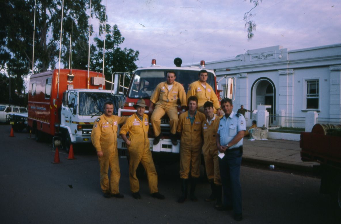 Operational Personal Protective Equipment Yellow Overalls and Group Officer Tony Jones at Nyngan, May 1990.