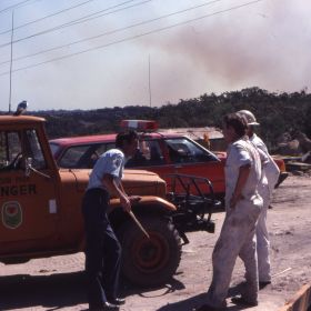 Operational Personal Protective Equipment White Overalls and Fire Control Officer Dress Uniform, 1980 Operational Personal Protective Equipment White Overalls and Fire Control Officer Dress Uniform, 1980