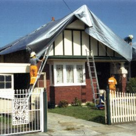 Sydney Storms, 1999 Tarpaulins cover the roofs of houses damaged during the Sydney Storms, 1999