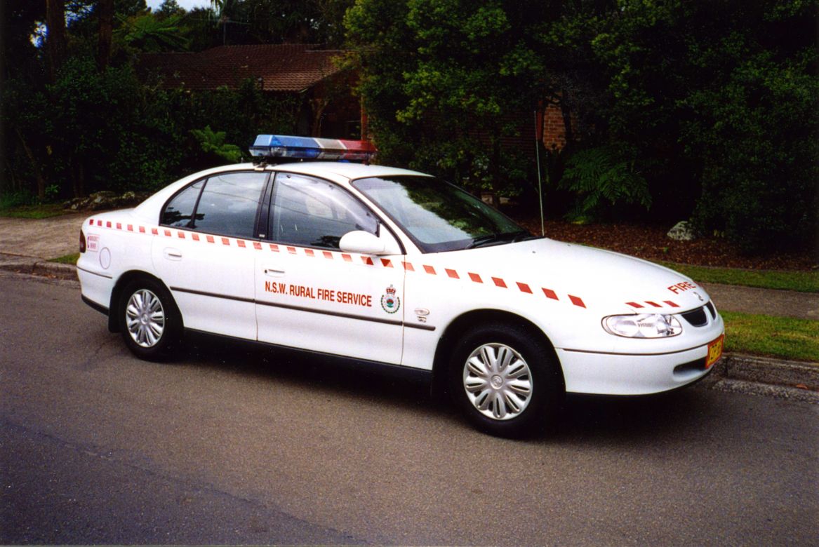 1999 Holden Commodore with NSW RFS Markings and Red and Blue Roof Light Bar Code 3 MX7000