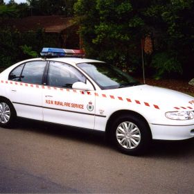 1999 Holden Commodore with NSW RFS Markings and Red and Blue Roof Light Bar Code 3 MX7000